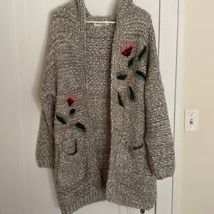 Oversized knit sweater with embroider floral details